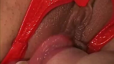 Horny Japanese MiLF in red latex with a strap on does some damage